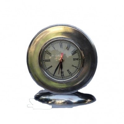 Round cast metal table clock with oval metal base in mirror polish available in other finishes available